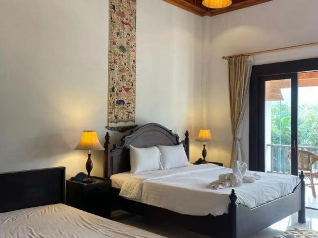 Bed in Nam Ou Riverside Resort