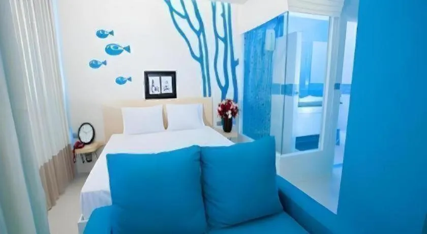 Bed in R-Con Blue Ocean Hotel