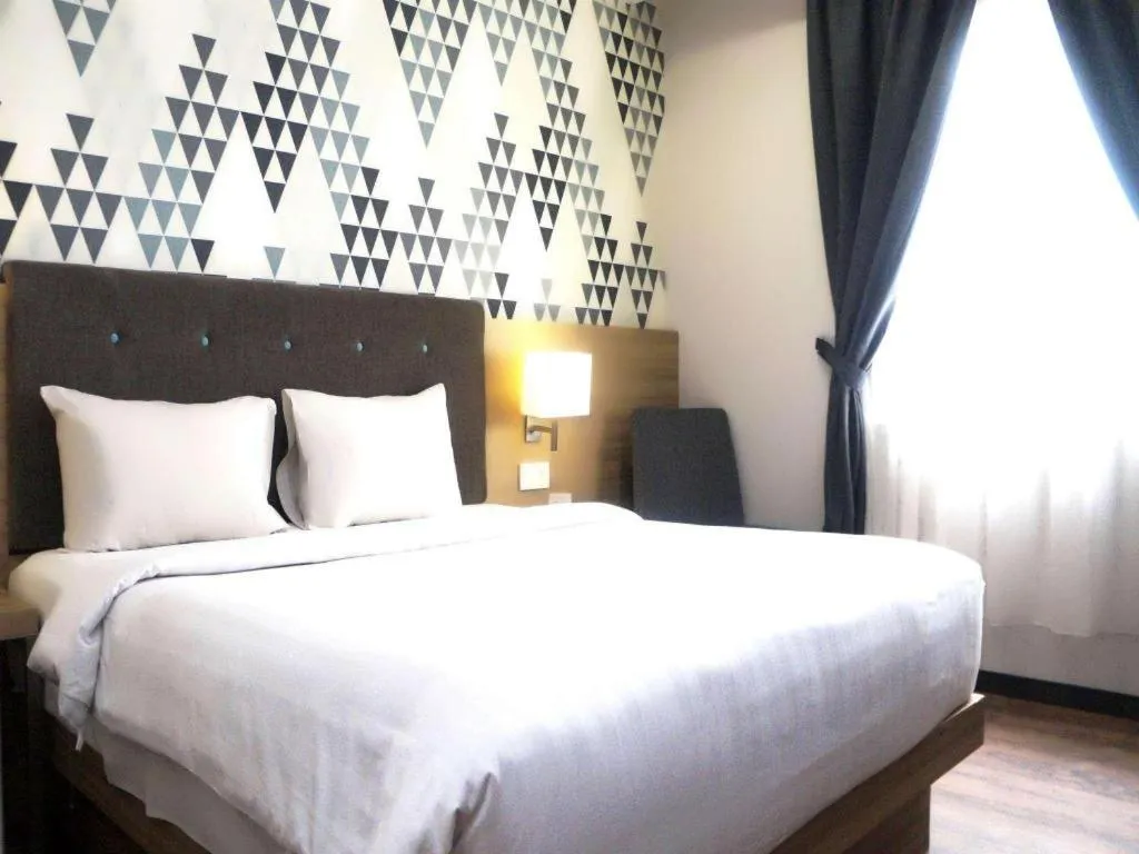 Bed in Orchardz Hotel Gajah Mada