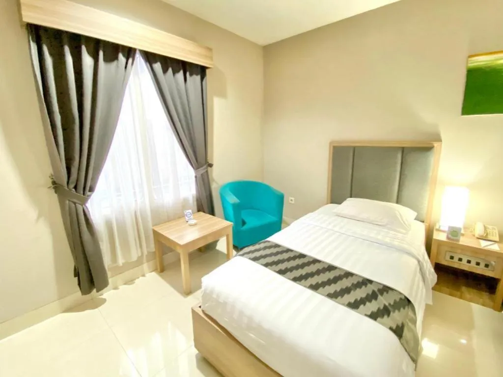 Bed in Orchardz Hotel Gajah Mada