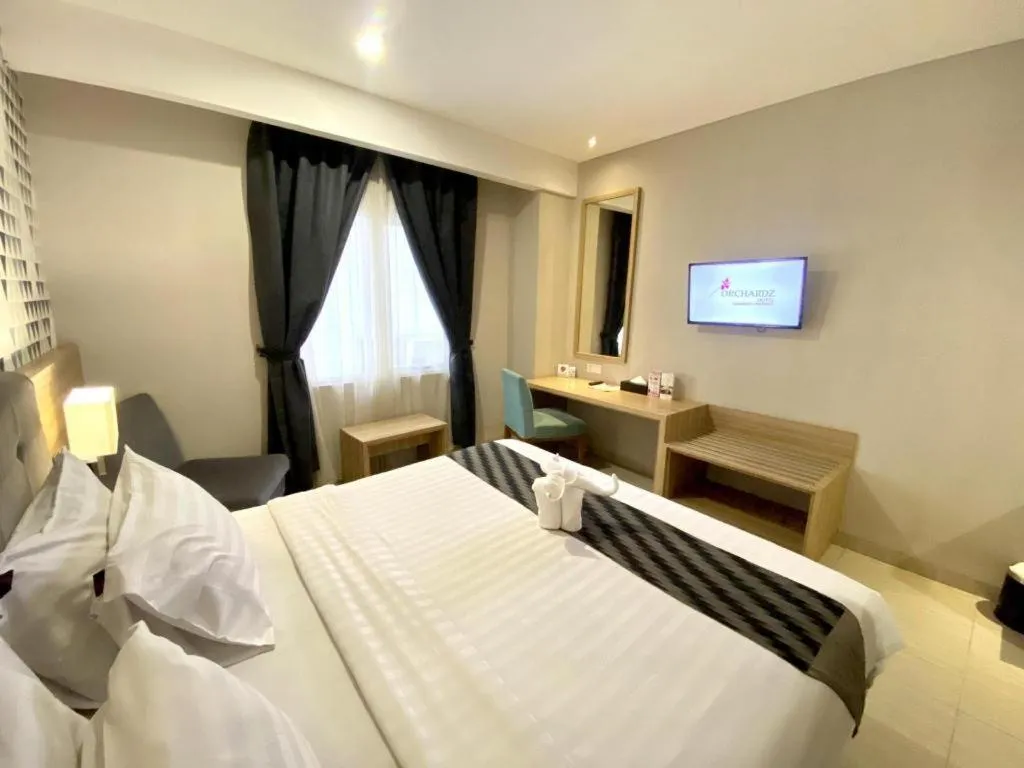 Bed in Orchardz Hotel Gajah Mada