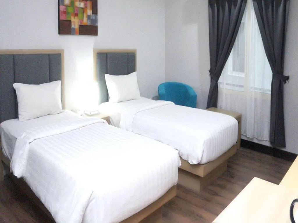 Bed in Orchardz Hotel Gajah Mada