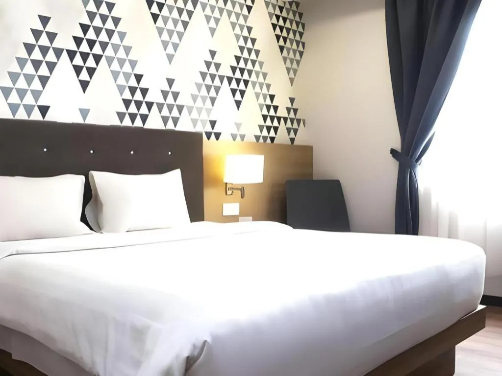 Bed in Orchardz Hotel Gajah Mada