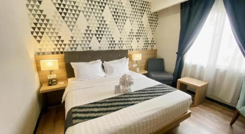 Bed in Orchardz Hotel Gajah Mada