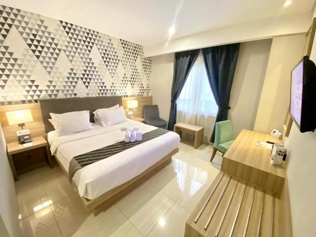 Bed in Orchardz Hotel Gajah Mada