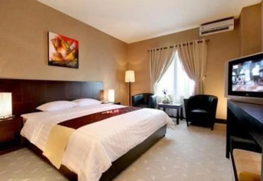 Bed in Orchardz Hotel Gajah Mada