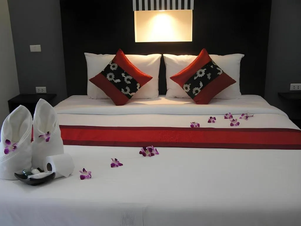 Bed in The Impress Khonkaen Hotel