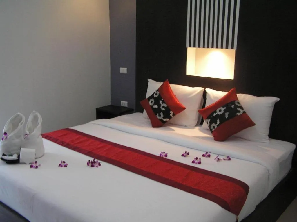 Bed in The Impress Khonkaen Hotel