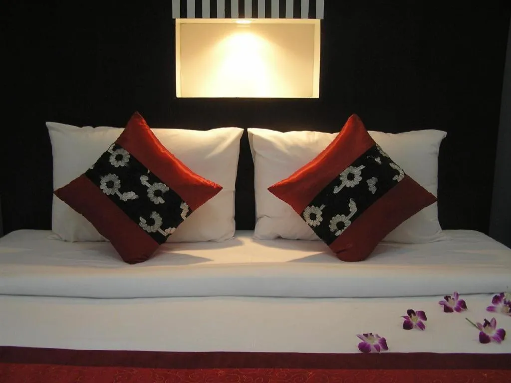 Bed in The Impress Khonkaen Hotel