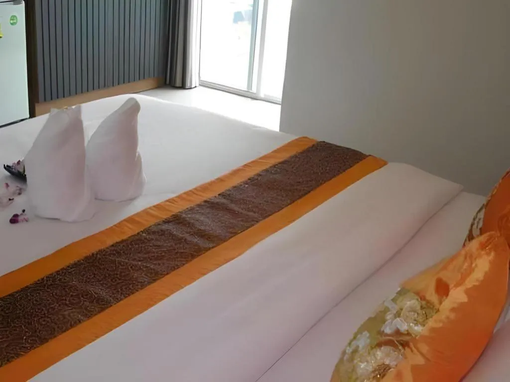 Bed in The Impress Khonkaen Hotel