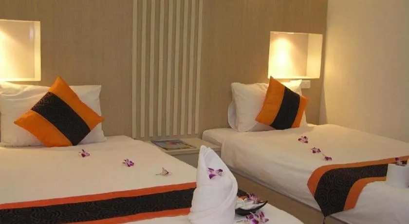 Bed in The Impress Khonkaen Hotel