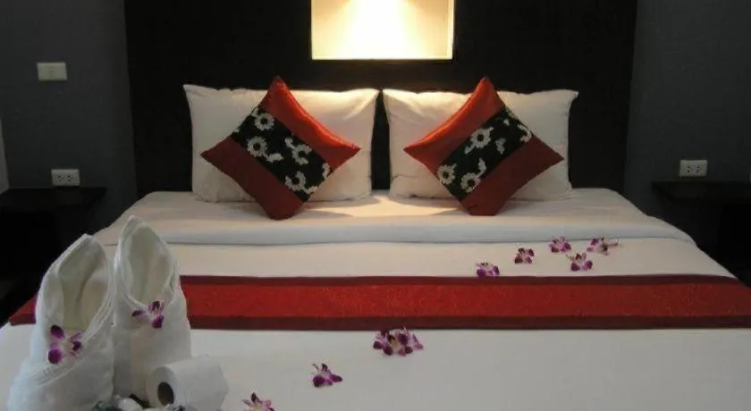 Bed in The Impress Khonkaen Hotel