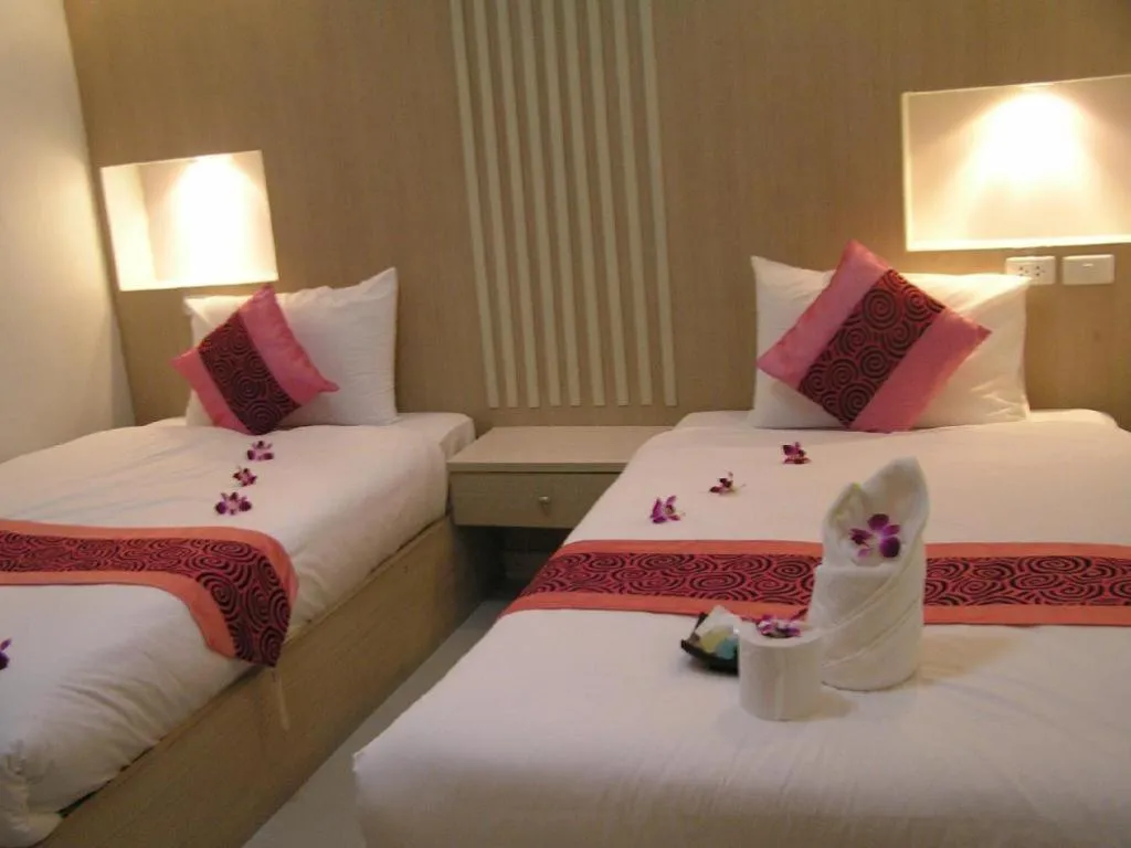 Bed in The Impress Khonkaen Hotel