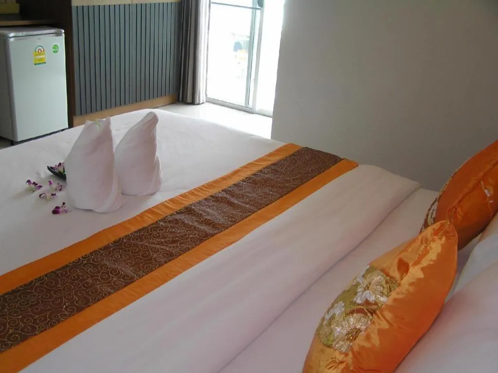 Bed in The Impress Khonkaen Hotel