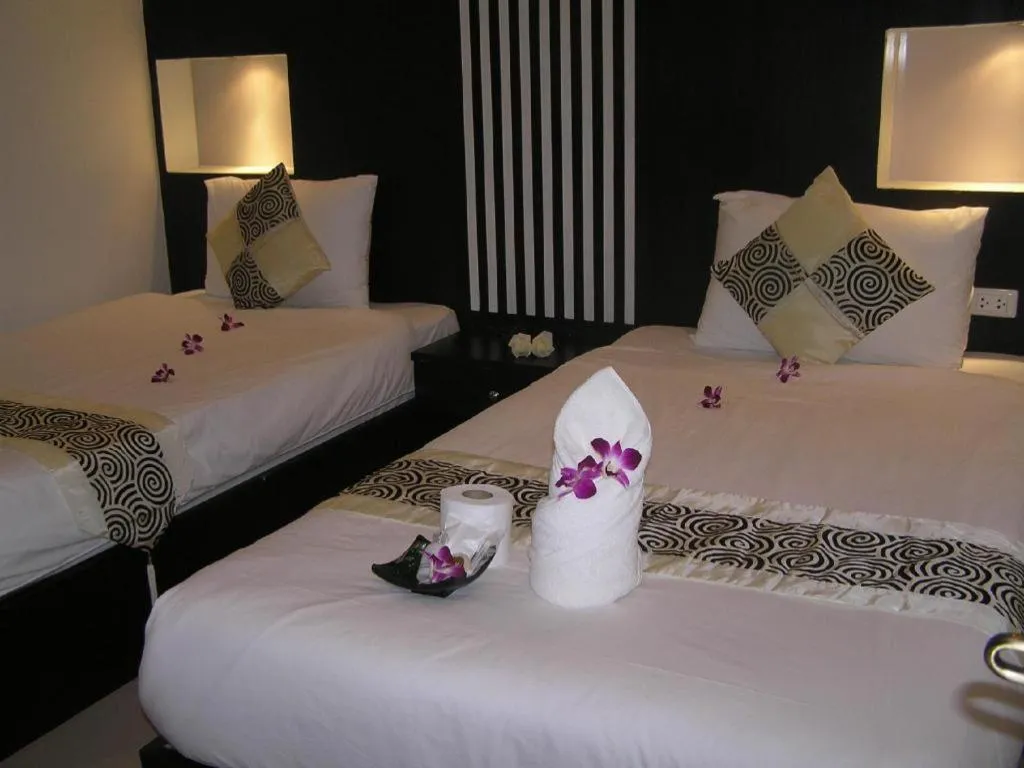 Bed in The Impress Khonkaen Hotel