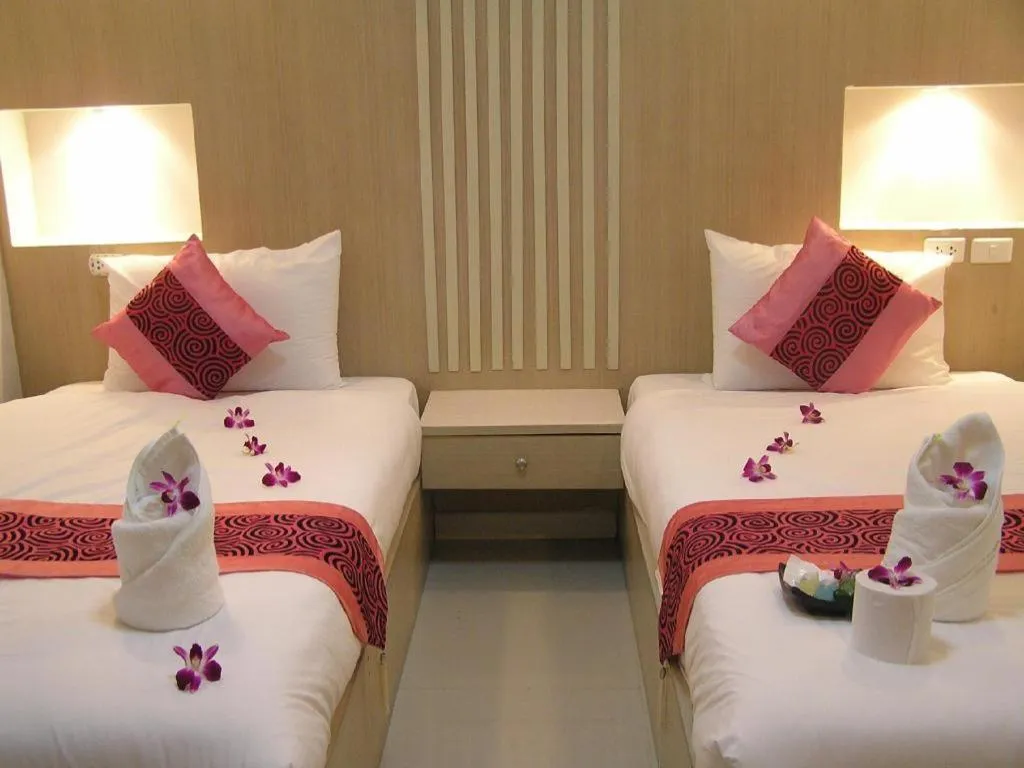 Bed in The Impress Khonkaen Hotel