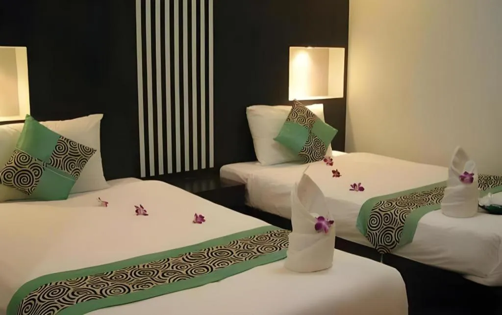 Bed in The Impress Khonkaen Hotel