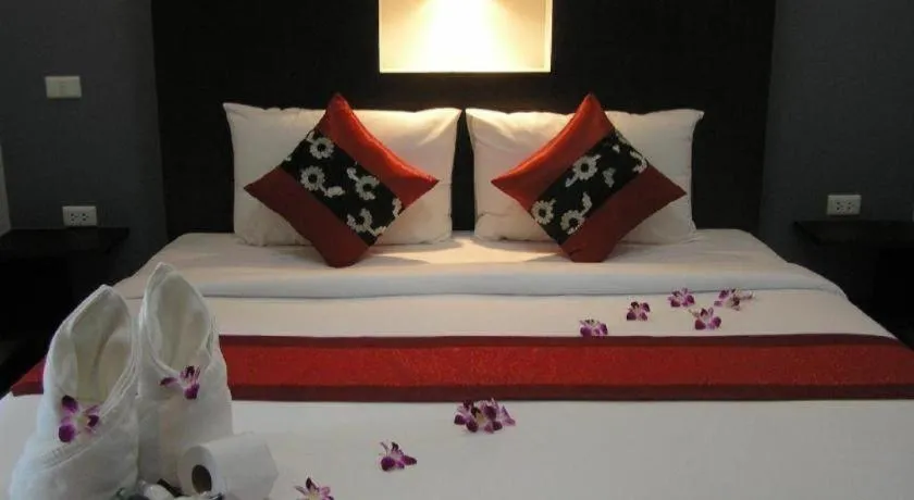 Bed in The Impress Khonkaen Hotel