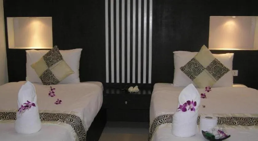 Bed in The Impress Khonkaen Hotel