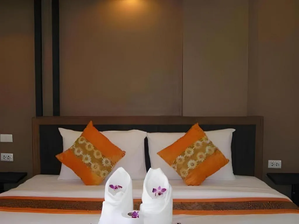 Bed in The Impress Khonkaen Hotel