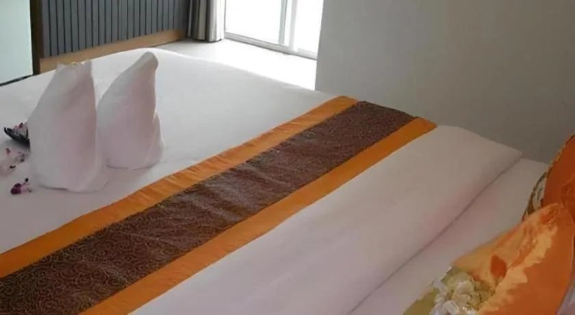 Bed in The Impress Khonkaen Hotel