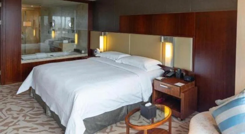 Bed in Kun Tai Glory Hotel Beijing Wangjing