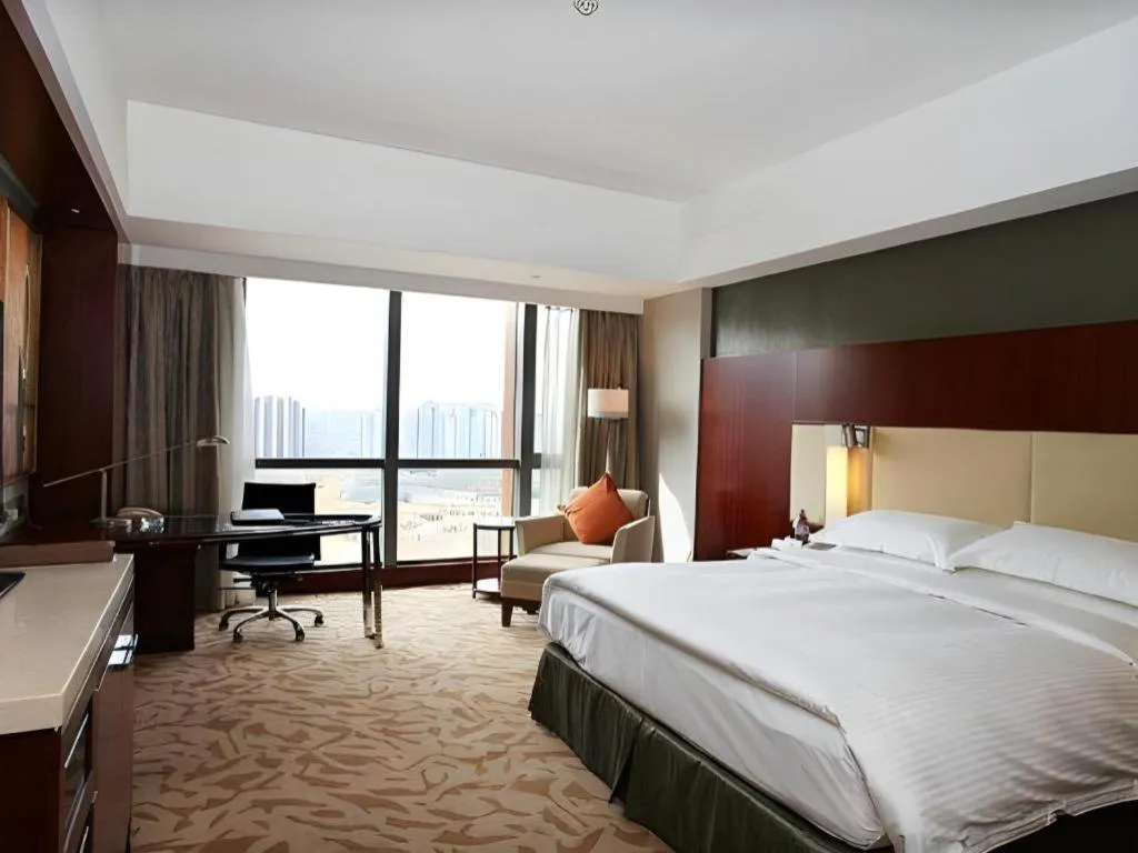 Bed in Kun Tai Glory Hotel Beijing Wangjing