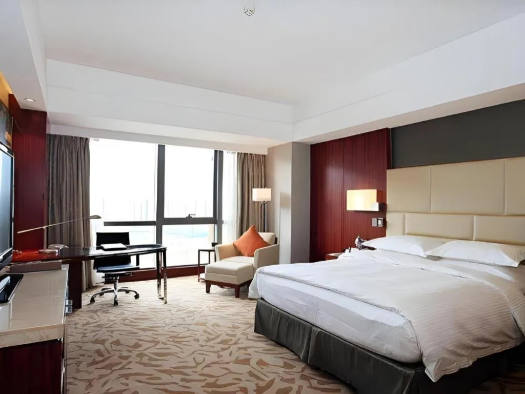 Bed in Kun Tai Glory Hotel Beijing Wangjing