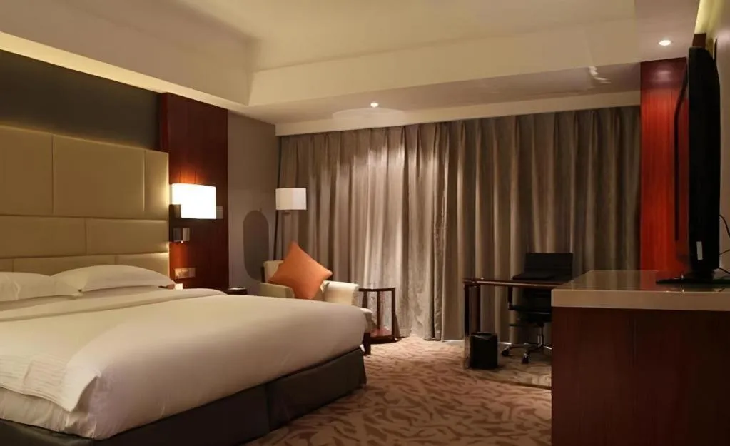 Bed in Kun Tai Glory Hotel Beijing Wangjing