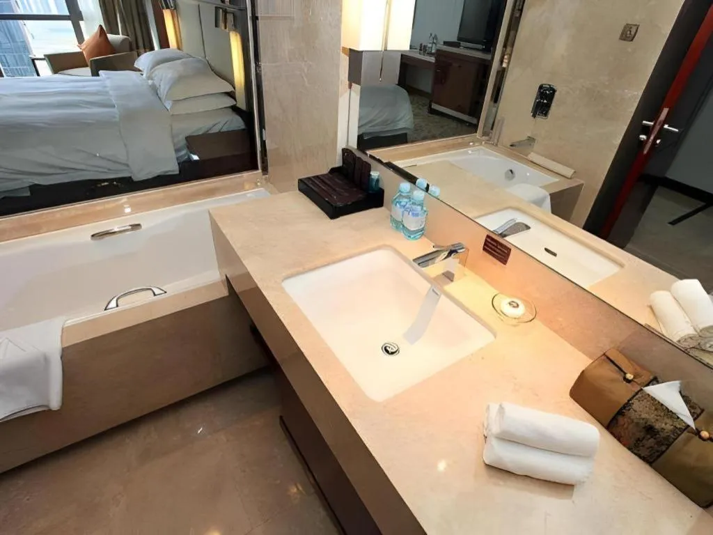 Bed in Kun Tai Glory Hotel Beijing Wangjing