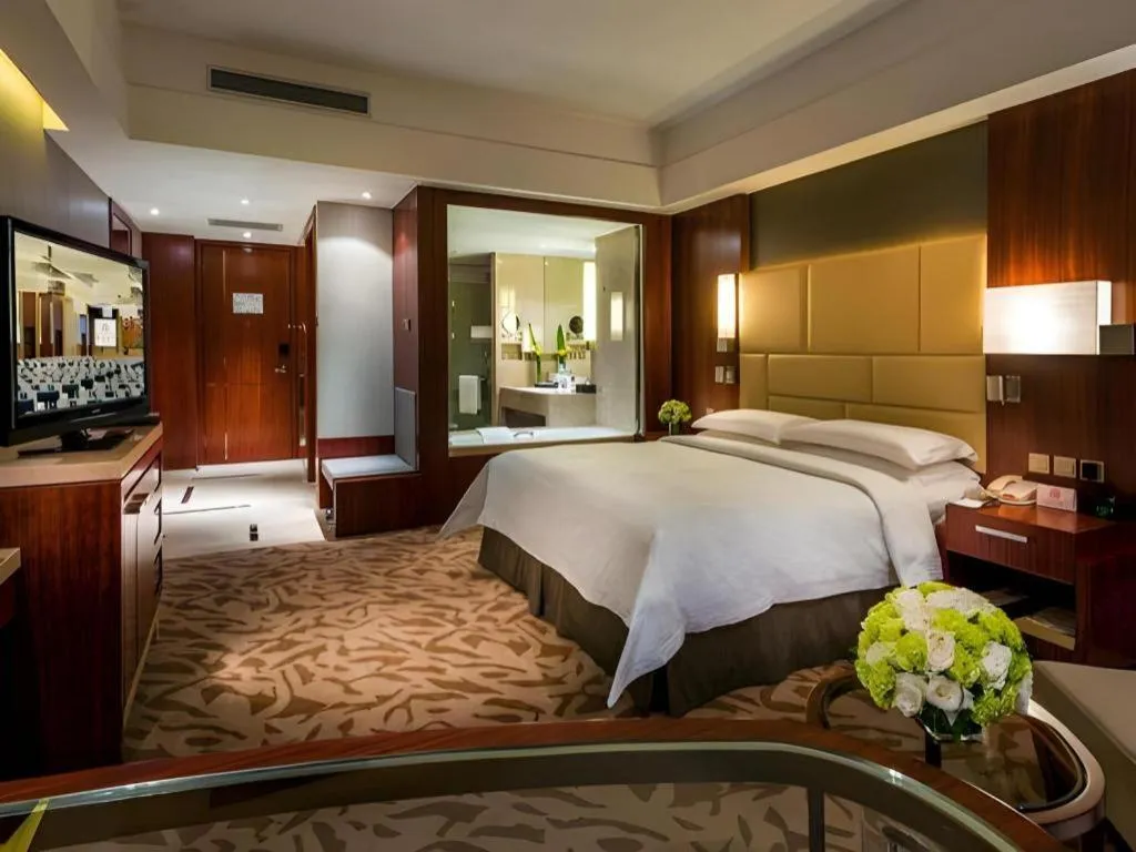 Bed in Kun Tai Glory Hotel Beijing Wangjing