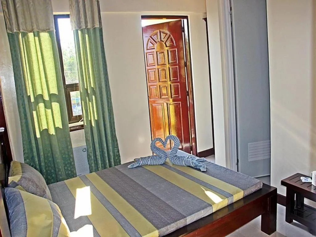 Bed in Costa Villa Beach Resort
