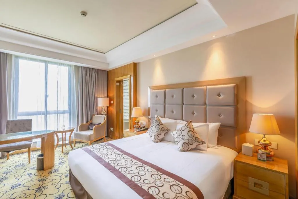 Bed in New Century Grand Hotel Xinxiang
