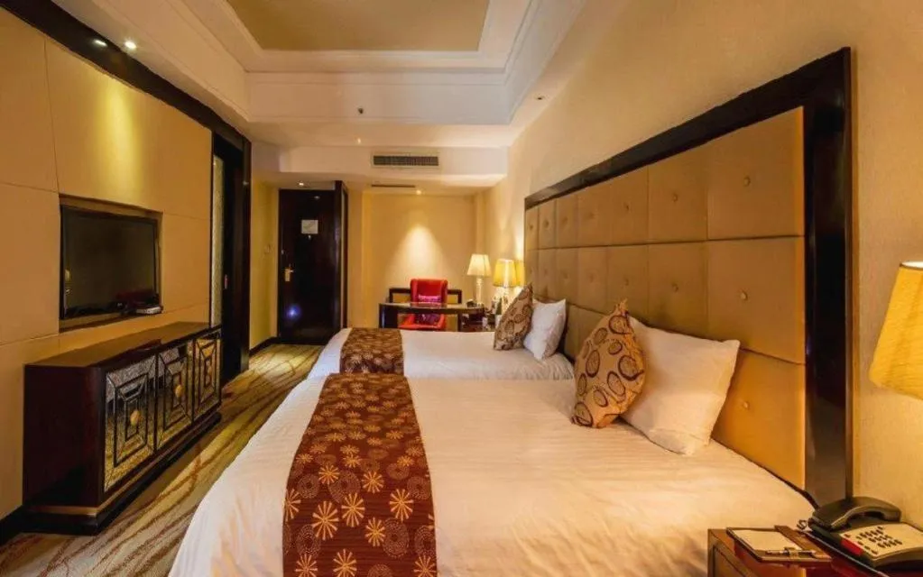 Bed in New Century Grand Hotel Xinxiang