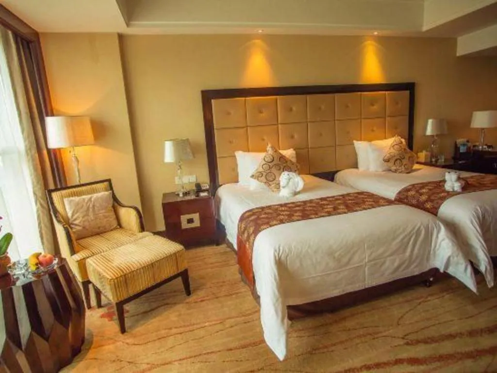 Bed in New Century Grand Hotel Xinxiang