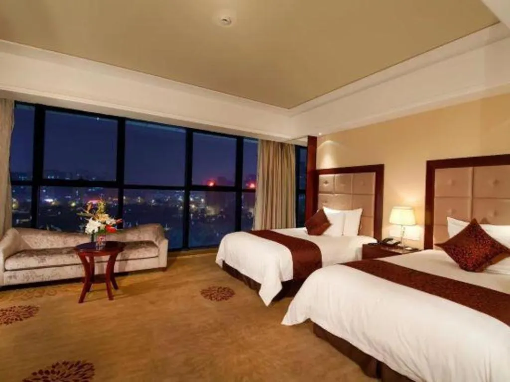 Bed in New Century Grand Hotel Xinxiang