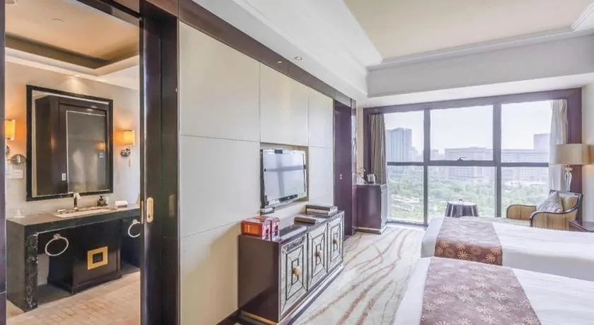 Bed in New Century Grand Hotel Xinxiang