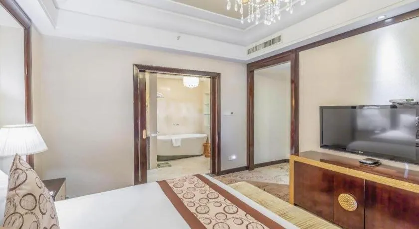 Bed in New Century Grand Hotel Xinxiang