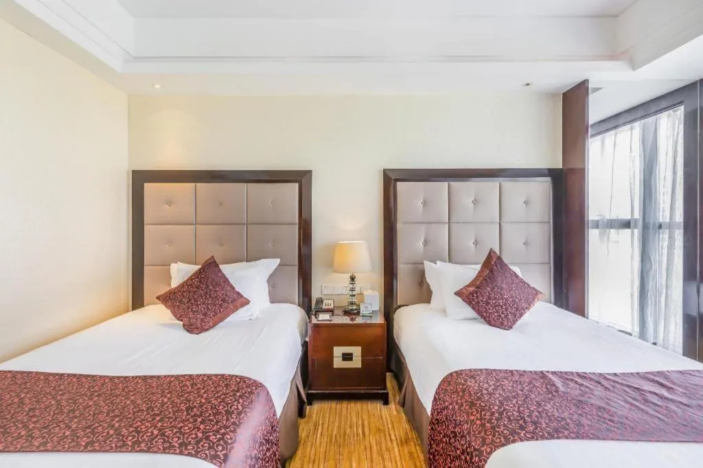 Bed in New Century Grand Hotel Xinxiang