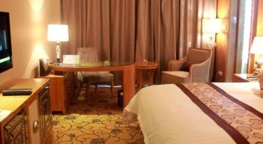 Bed in New Century Grand Hotel Xinxiang