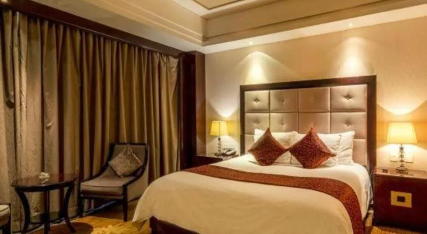 Bed in New Century Grand Hotel Xinxiang