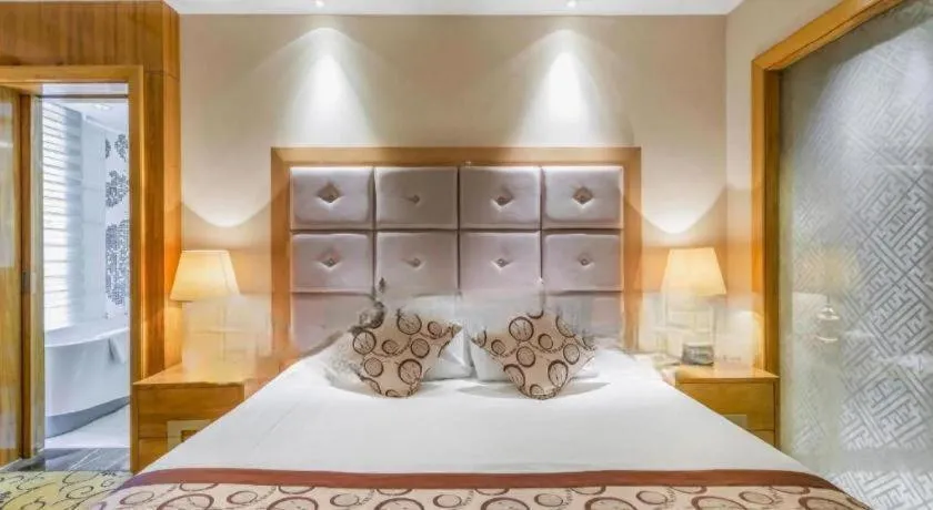 Bed in New Century Grand Hotel Xinxiang