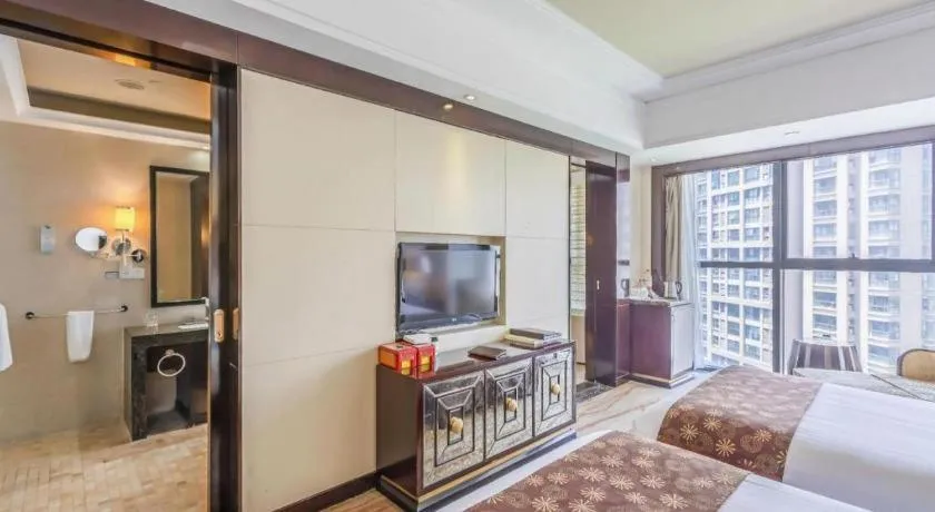 Bed in New Century Grand Hotel Xinxiang