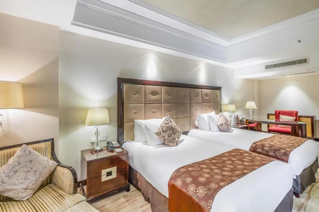 Bed in New Century Grand Hotel Xinxiang