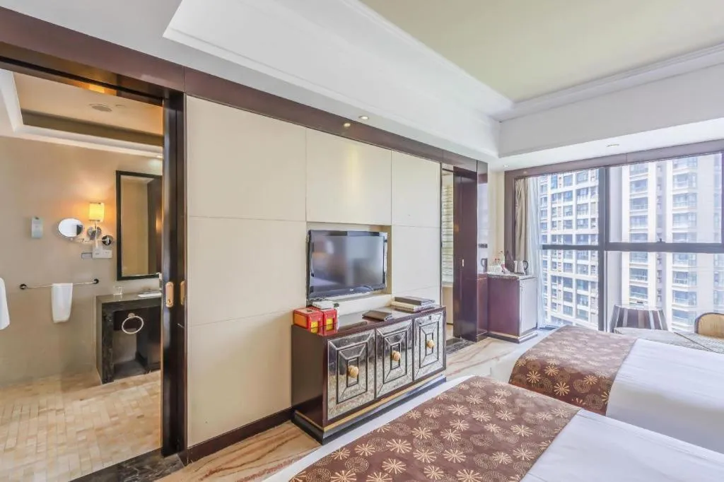 Bed in New Century Grand Hotel Xinxiang