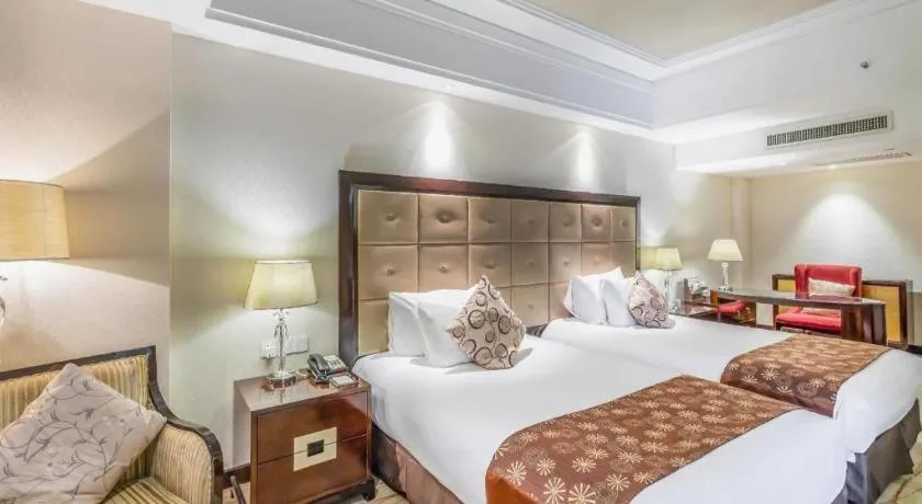 Bed in New Century Grand Hotel Xinxiang