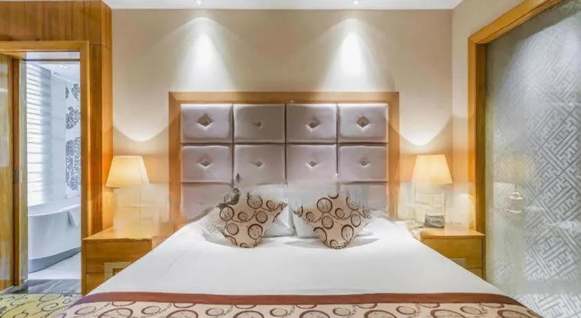 Bed in New Century Grand Hotel Xinxiang
