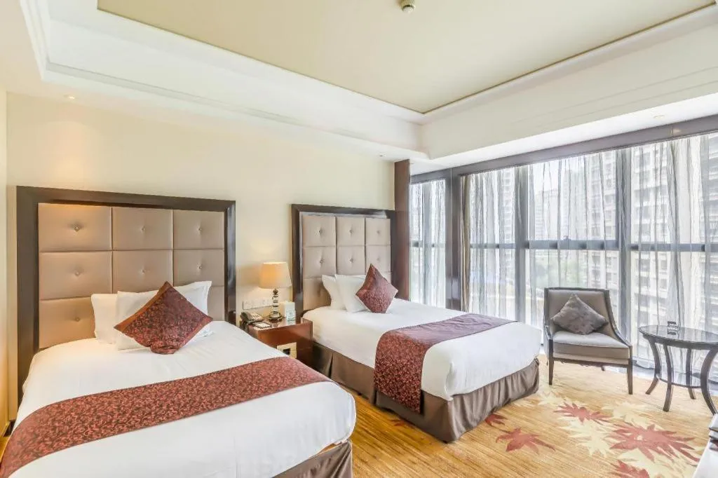 Bed in New Century Grand Hotel Xinxiang