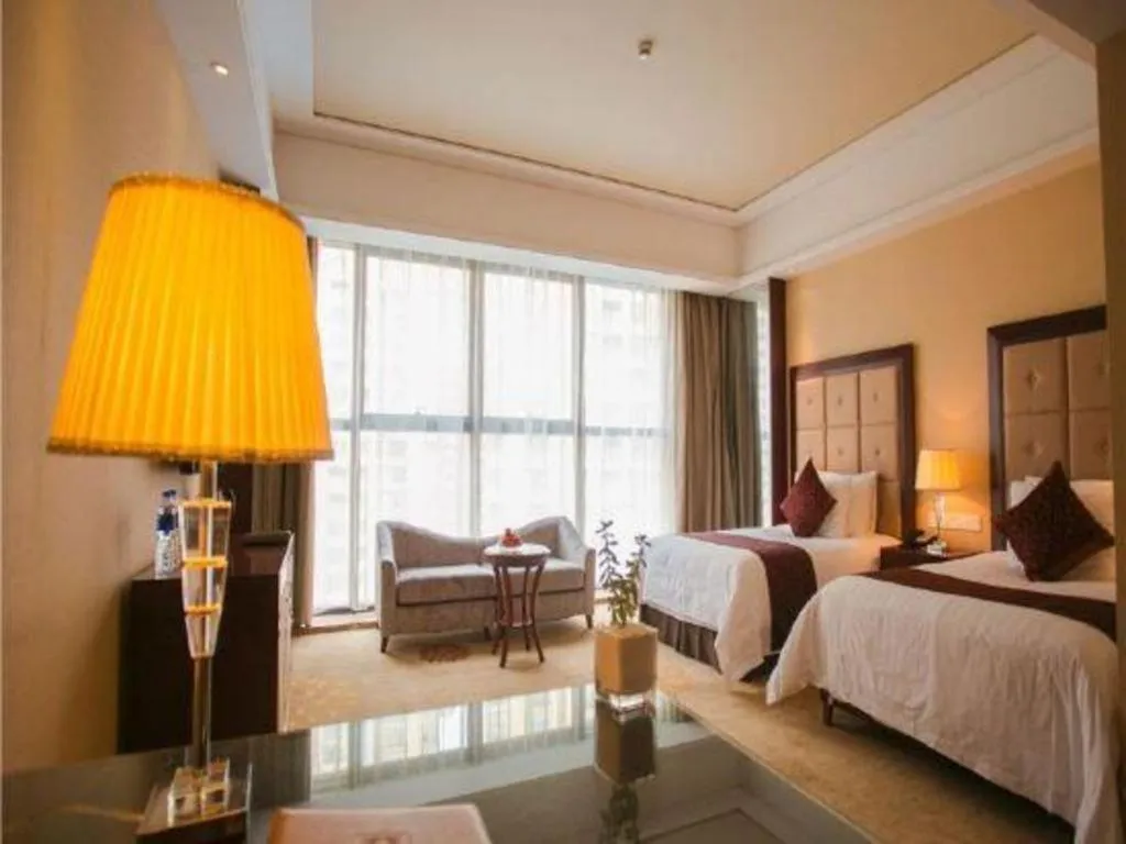 Bed in New Century Grand Hotel Xinxiang