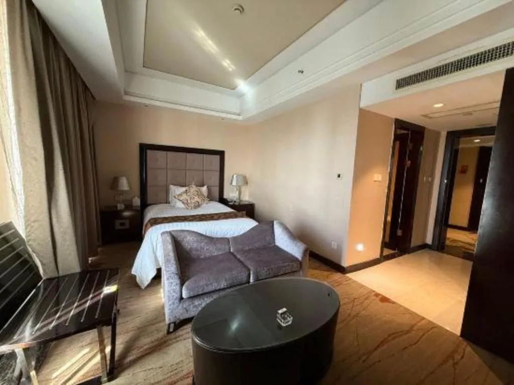 Bed in New Century Grand Hotel Xinxiang